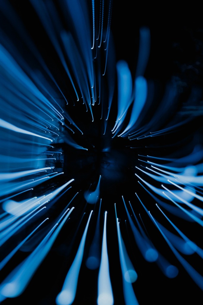 pexels-photo-35496838-35496838 Dynamic abstract image showcasing blue light streaks captured in motion with a dark background.